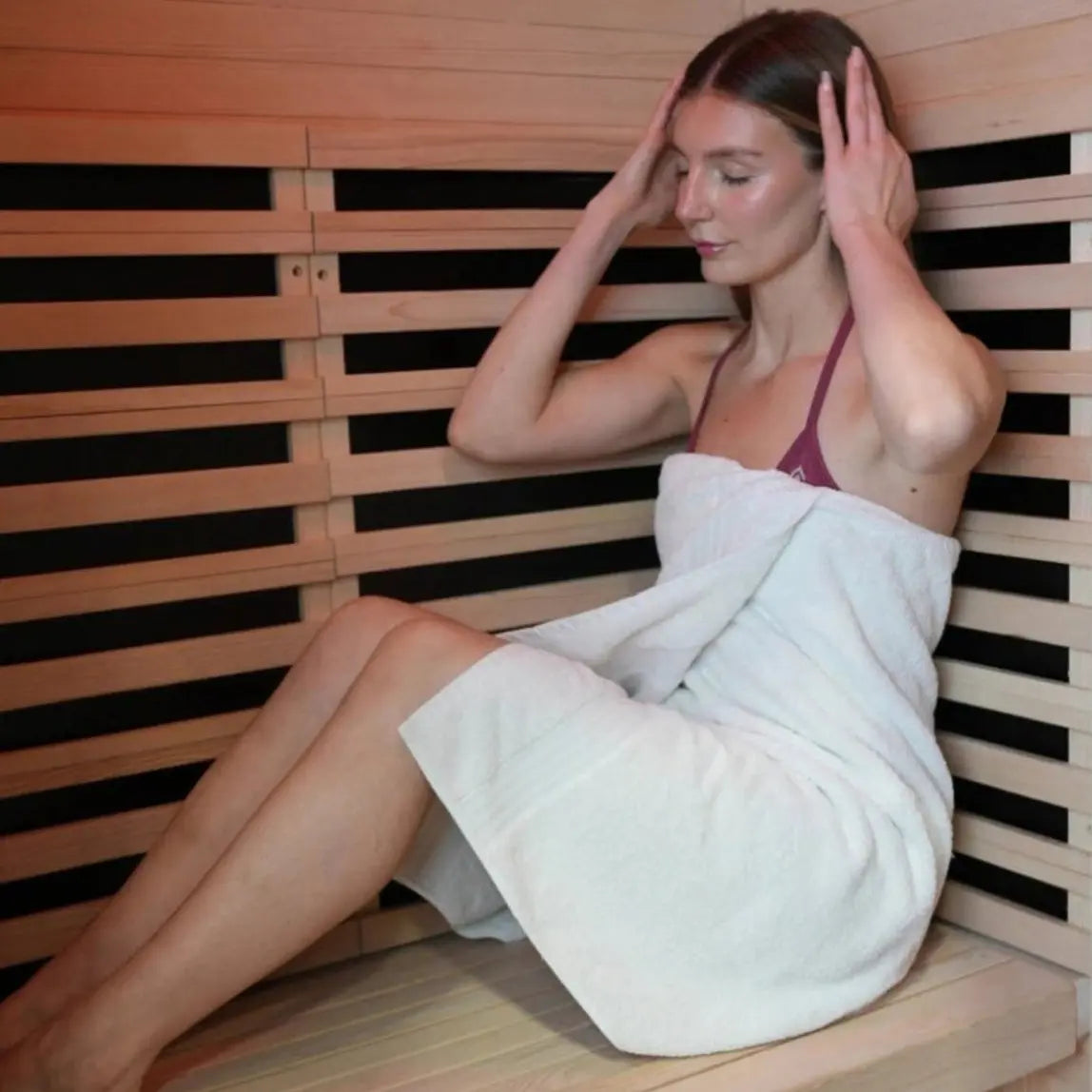 Woman sitting in sauna